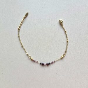 Bracelet en acier inoxydable doré et pierre rose et noir au centre